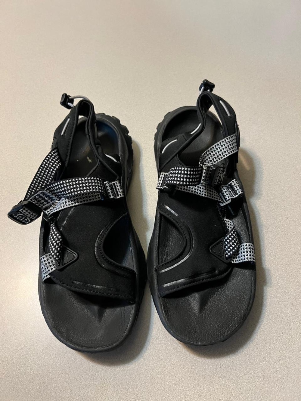 Nike Black Sandals with White-Patterned Straps